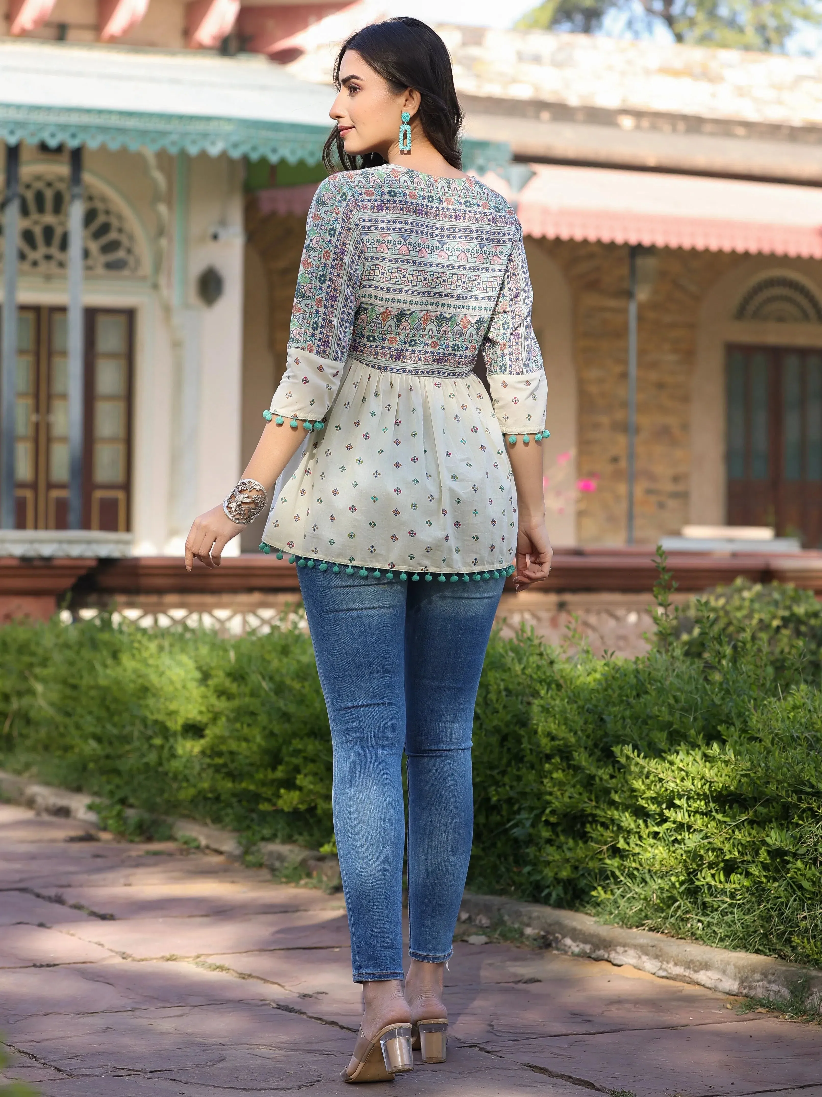 Women Ivory Cotton Cambric Tribal Printed Peplum Tunic.