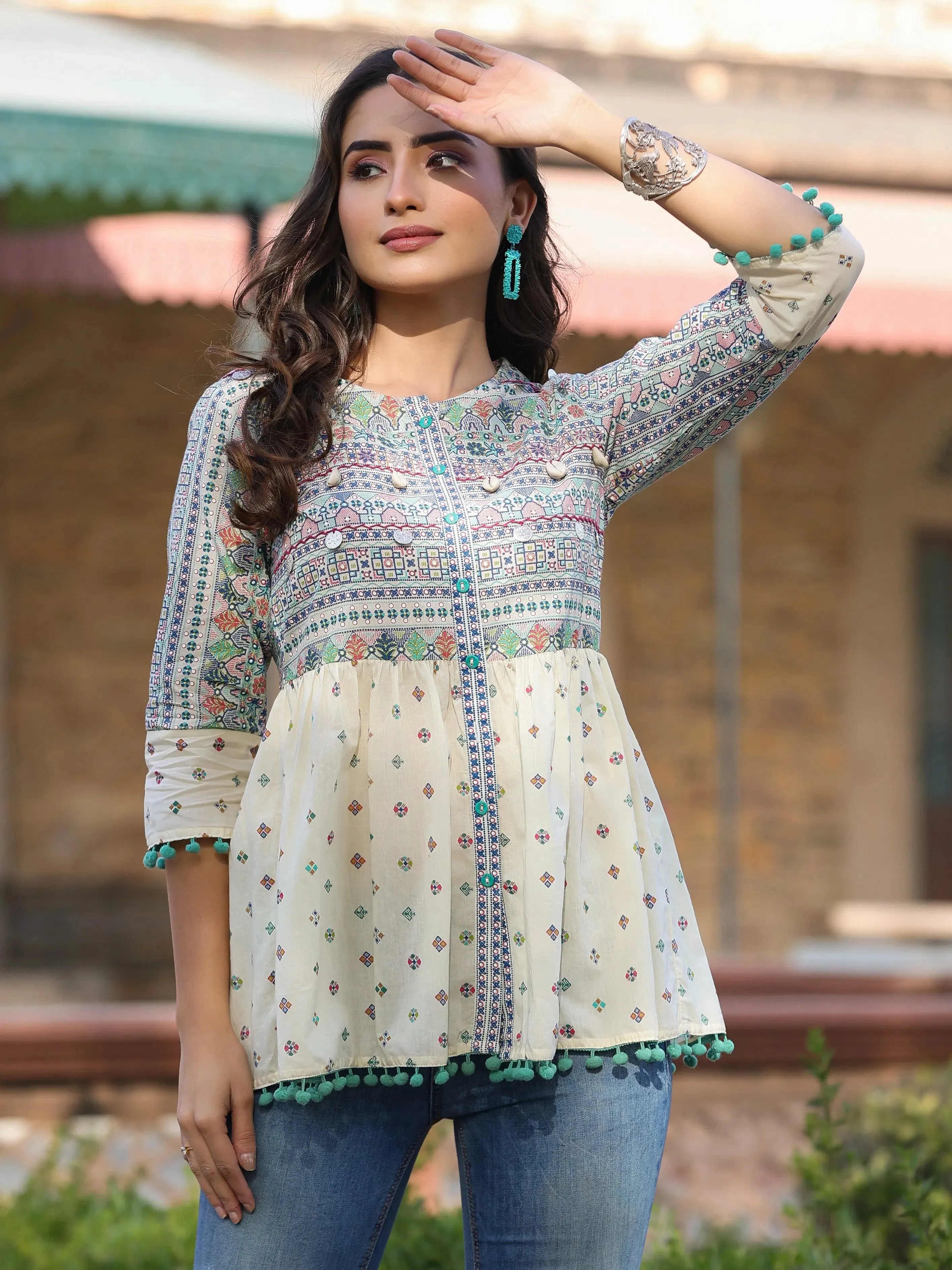Women Ivory Cotton Cambric Tribal Printed Peplum Tunic.