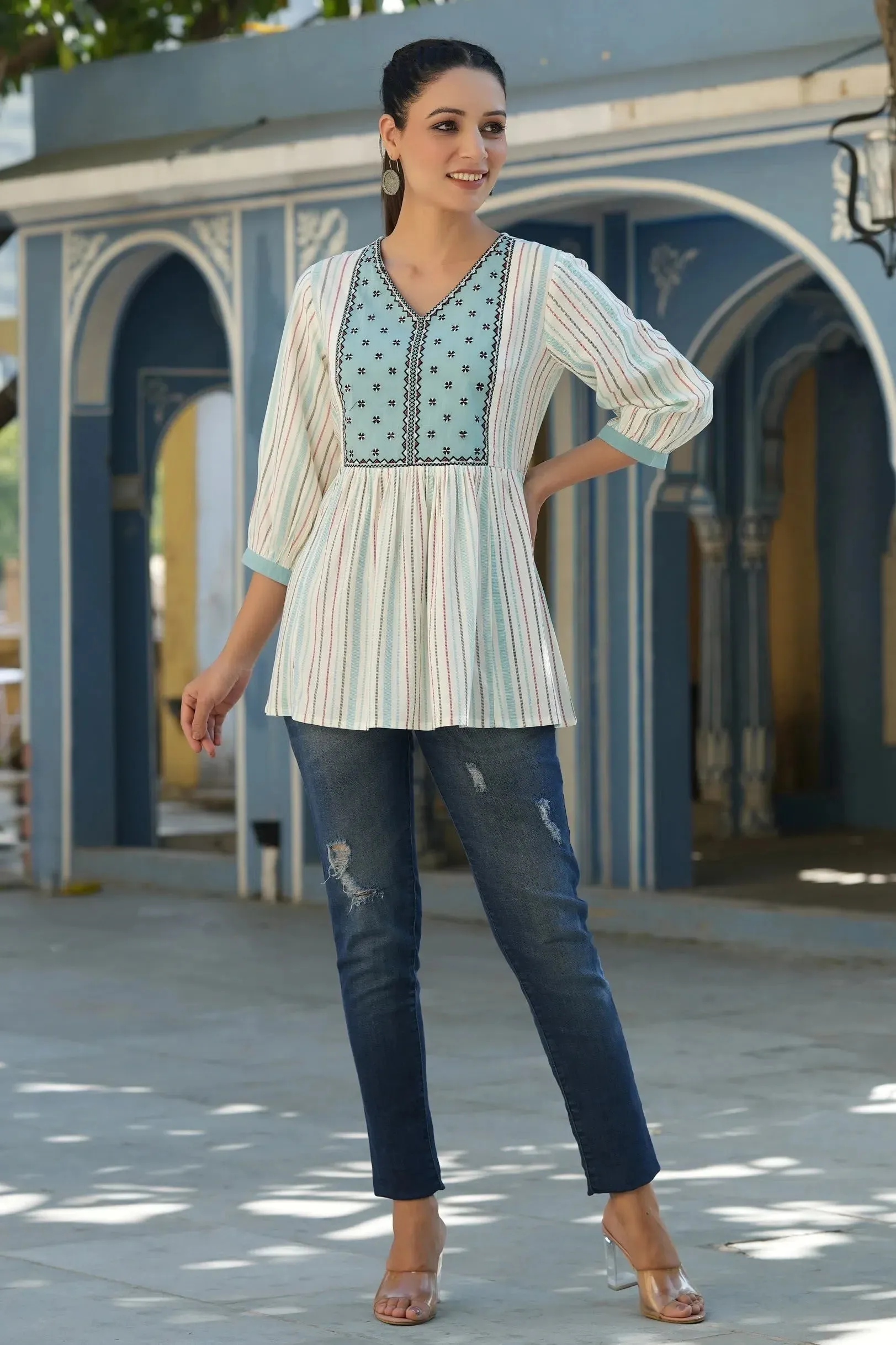 Women Ivory Rayon Staple Striped Printed Peplum Tunic.